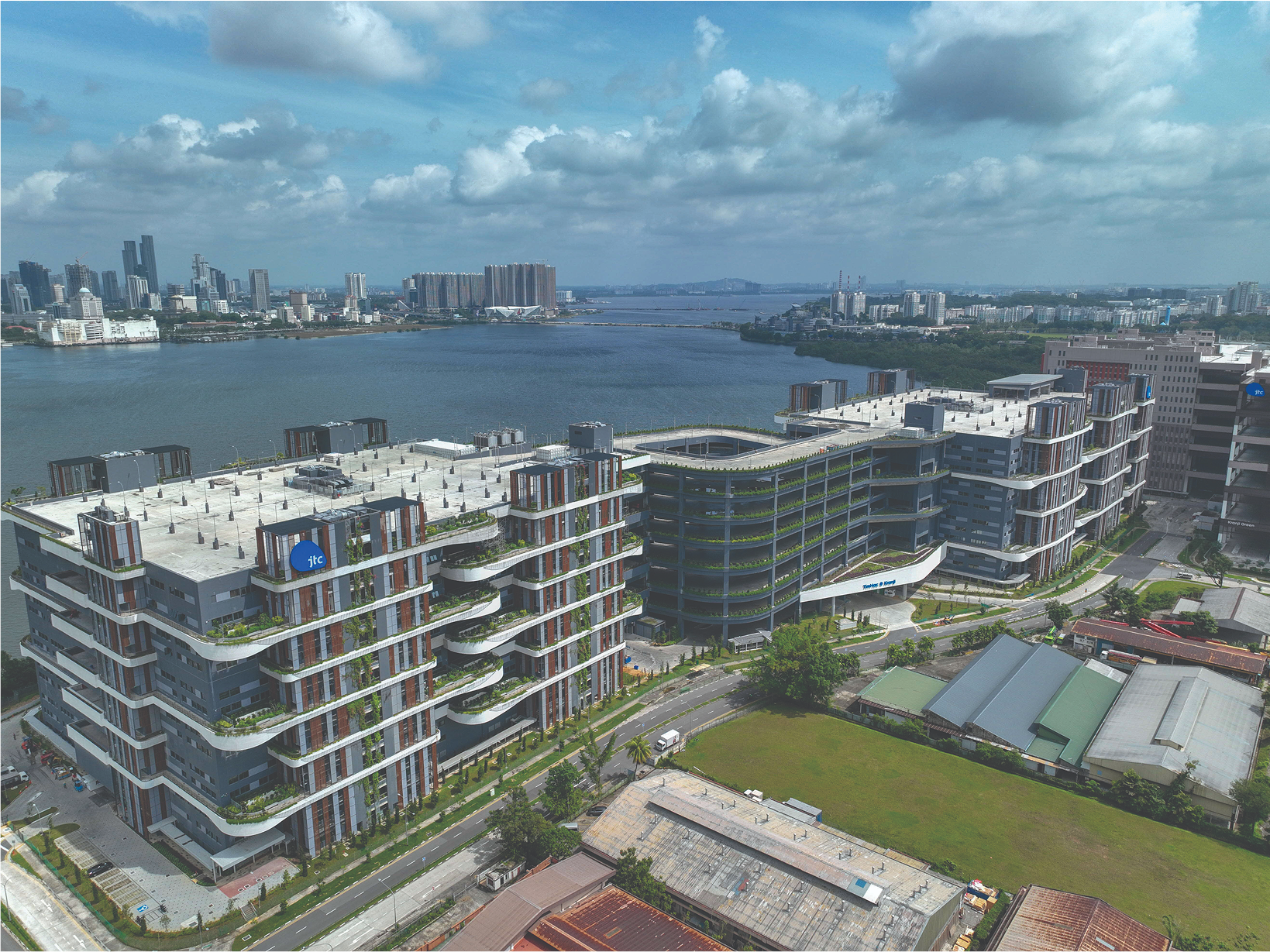 Aerial photo of high-rise industrial building along waterfront